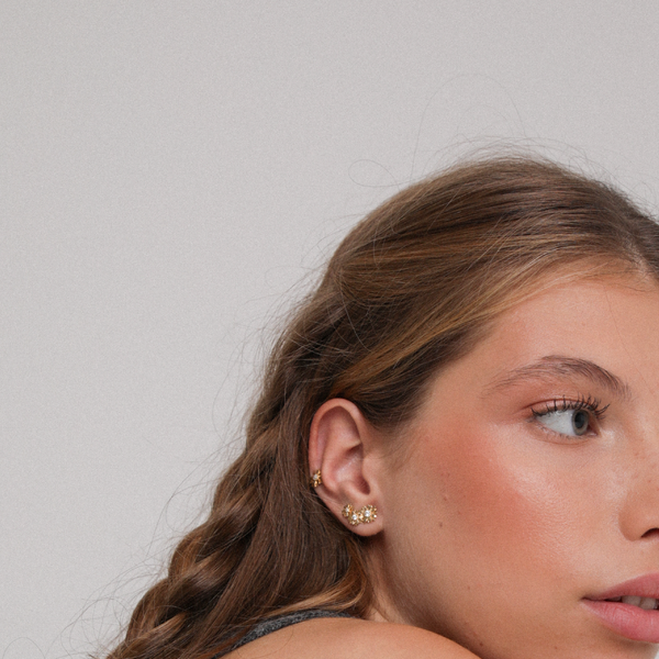 Model Wearing Asymmetrical Daisy Earrings