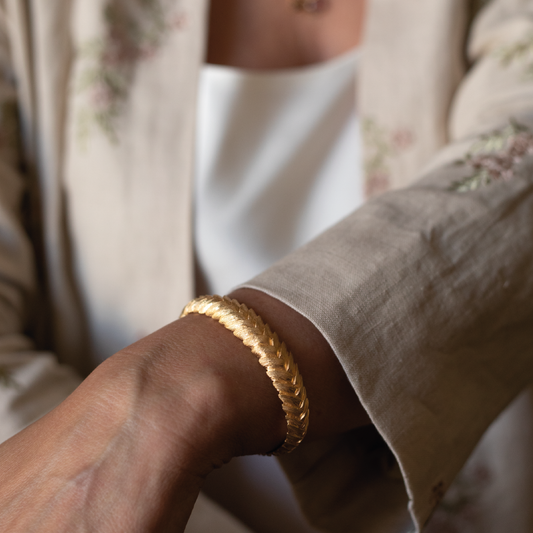 Model wearing Bromelia Flower Braided Cuff